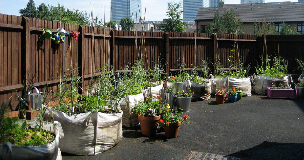 Urban raised bed garden made of grow bags. 